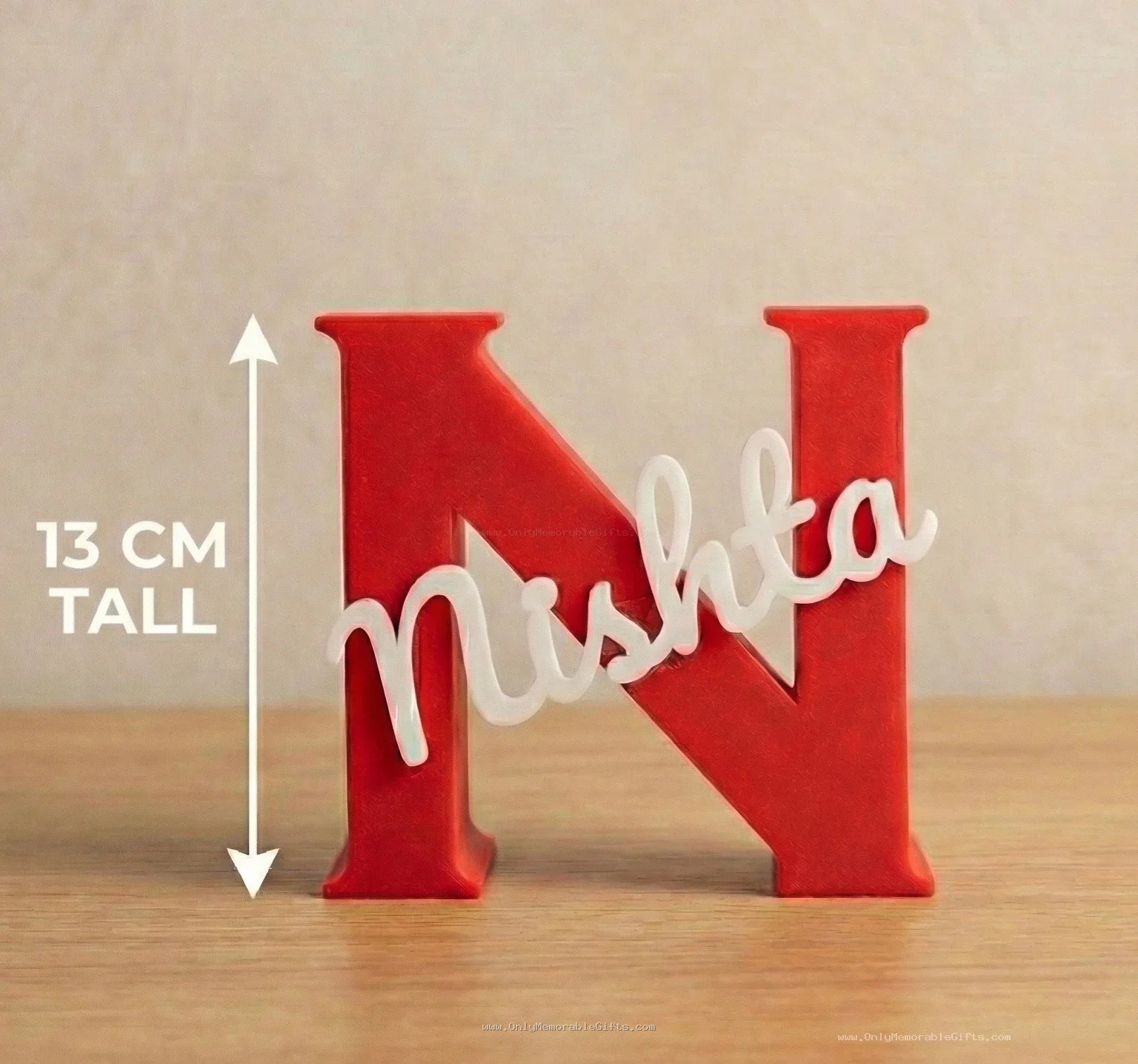 Red 3D printed letter N pen stand with custom name Nishta in white cursive
