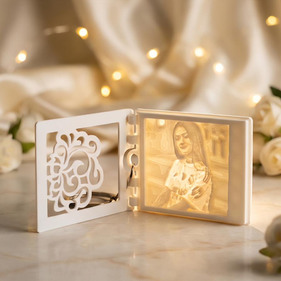 White PLA lithophane keychain showing photo when light passes througt
