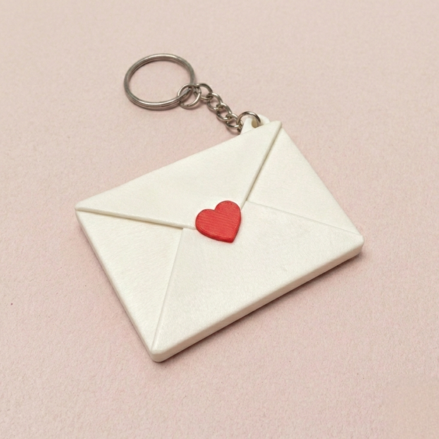 Envelope style personalized photo keychain showing sliding custom image inside