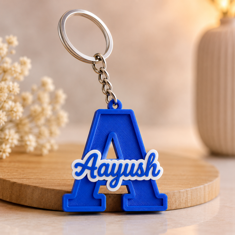 Custom name blue keychain with alphabet design